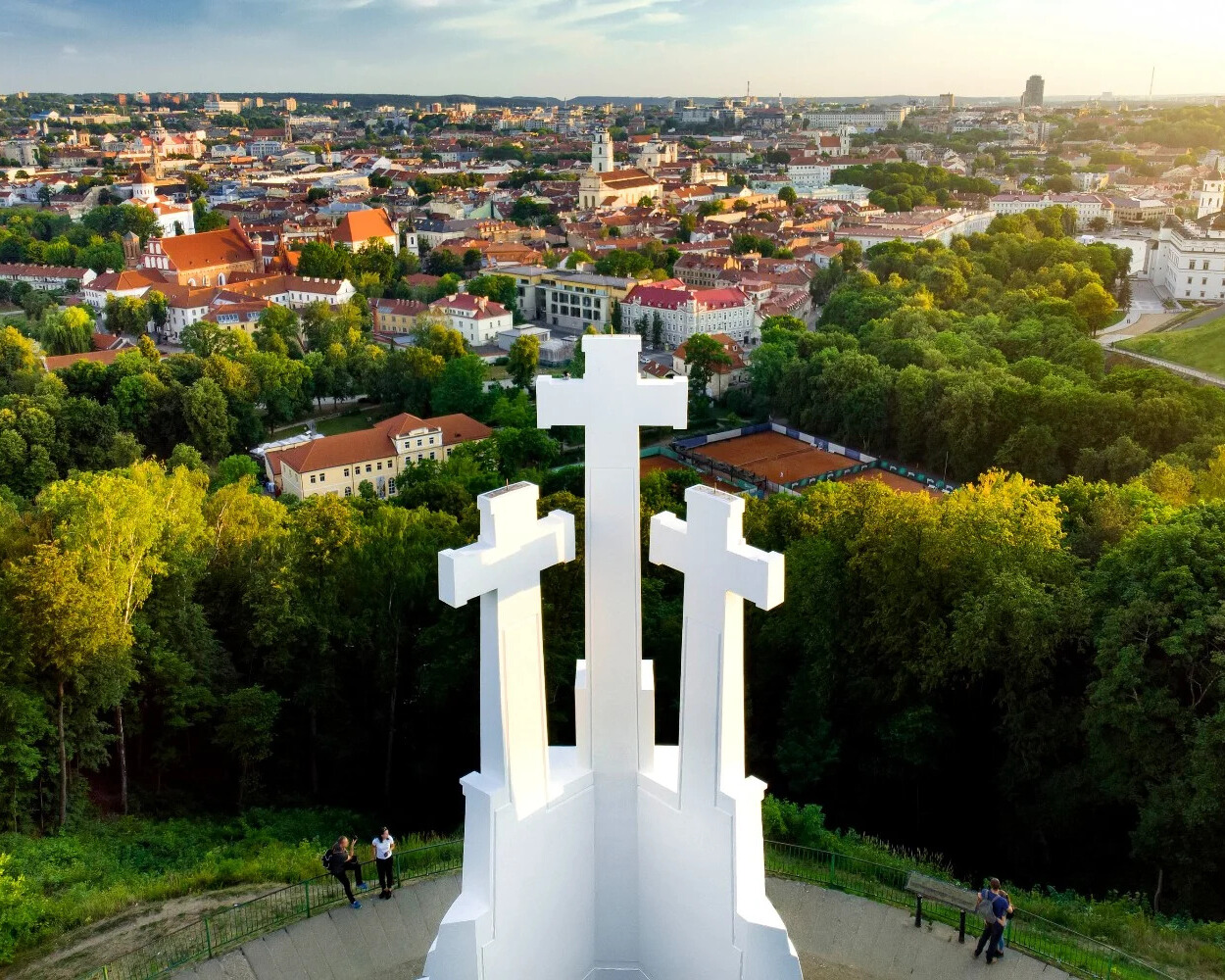 The Three Crosses memorial from a bird's eye view with a city panorama in the background.